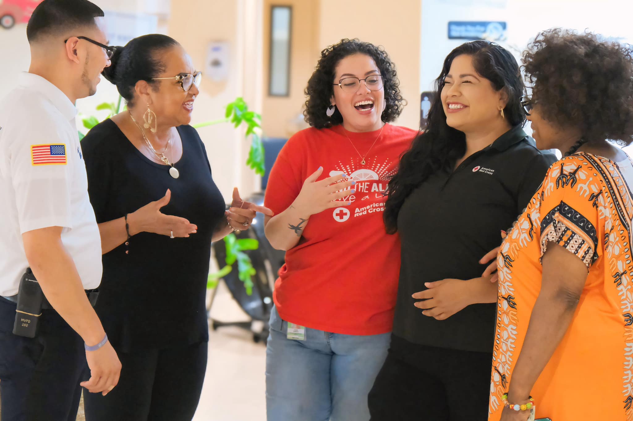 Rebecca laughing with a group of people