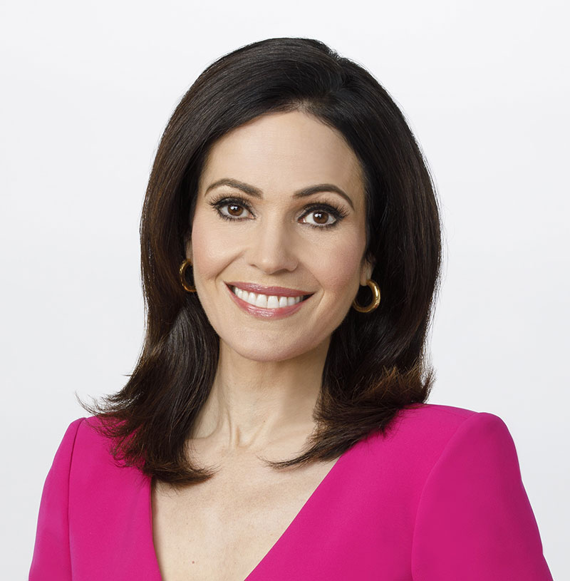 Tanya Rivero wearing pink dress and smiling for picture.