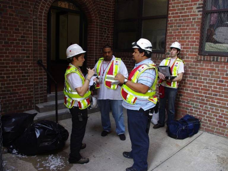 dario with group of volunteers outside of home