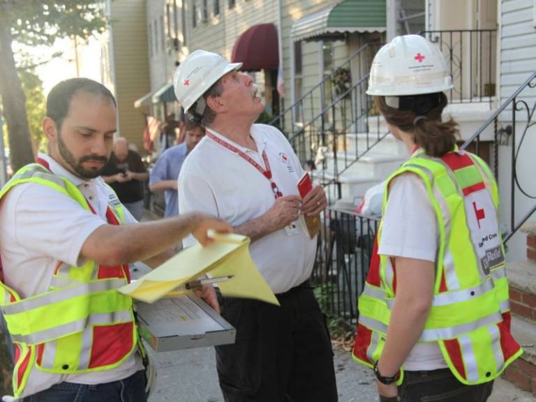 raul and others overviewing house in neighborhood