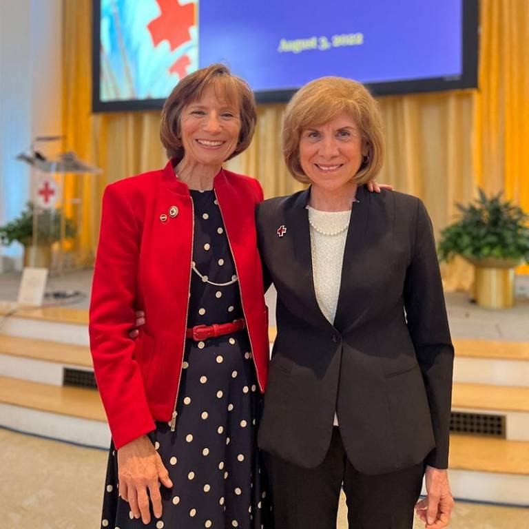 Sue standing next to Gail McGovern