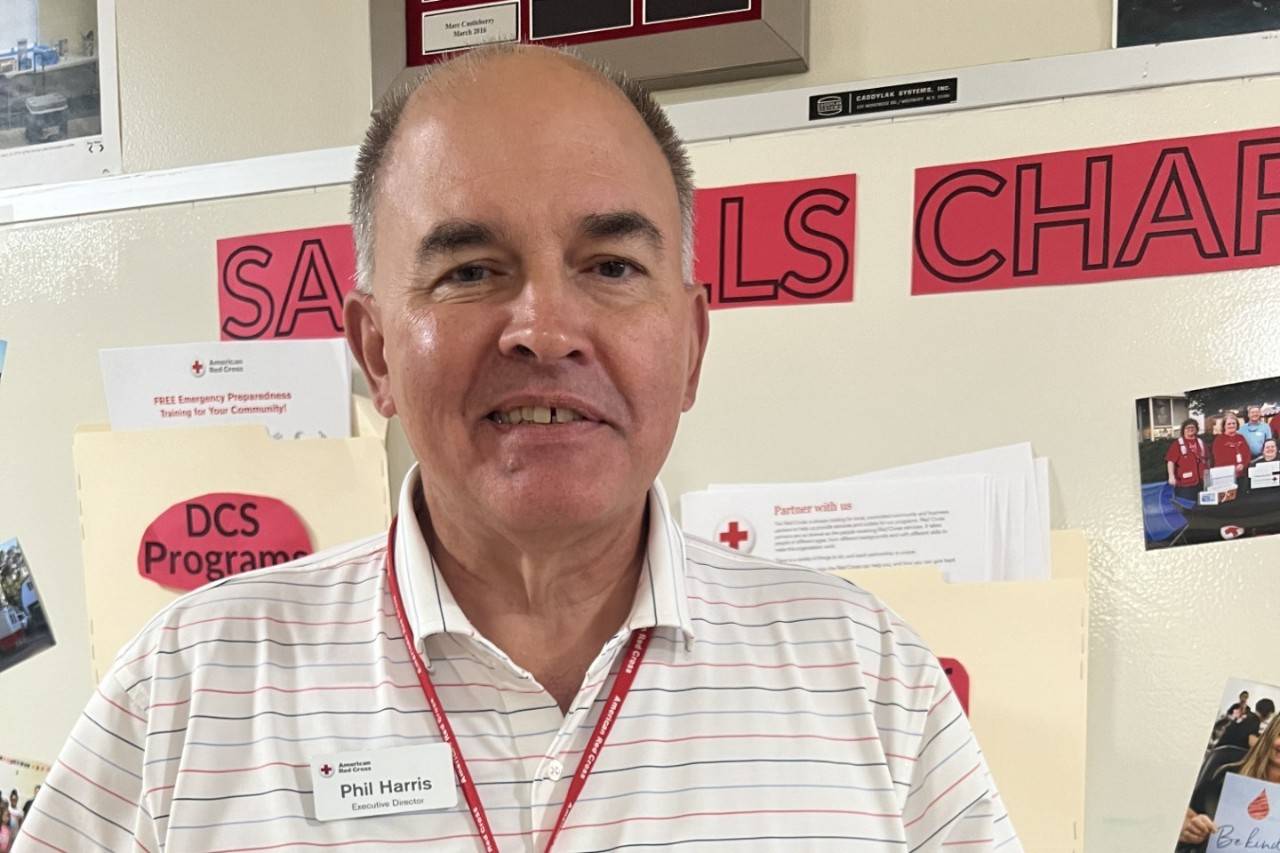 Picture of man in white polo