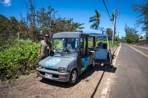 Tyler Jeffries, founder of Love Bubble Coffee, stands beside his solar-powered coffee cart on Kauaʻi’s North Shore on Sept. 14, 2026. Following Hurricane Lowell, Jeffries turned the cart into a community hub where residents could get coffee, charge devices and connect to free Starlink internet. “It’s just become like a central hub for being able to feel a little bit normal for a second,” Jeffries said. “I’m just a little sand in the bucket over here.” Photo by Scott Marder/American Red Cross.