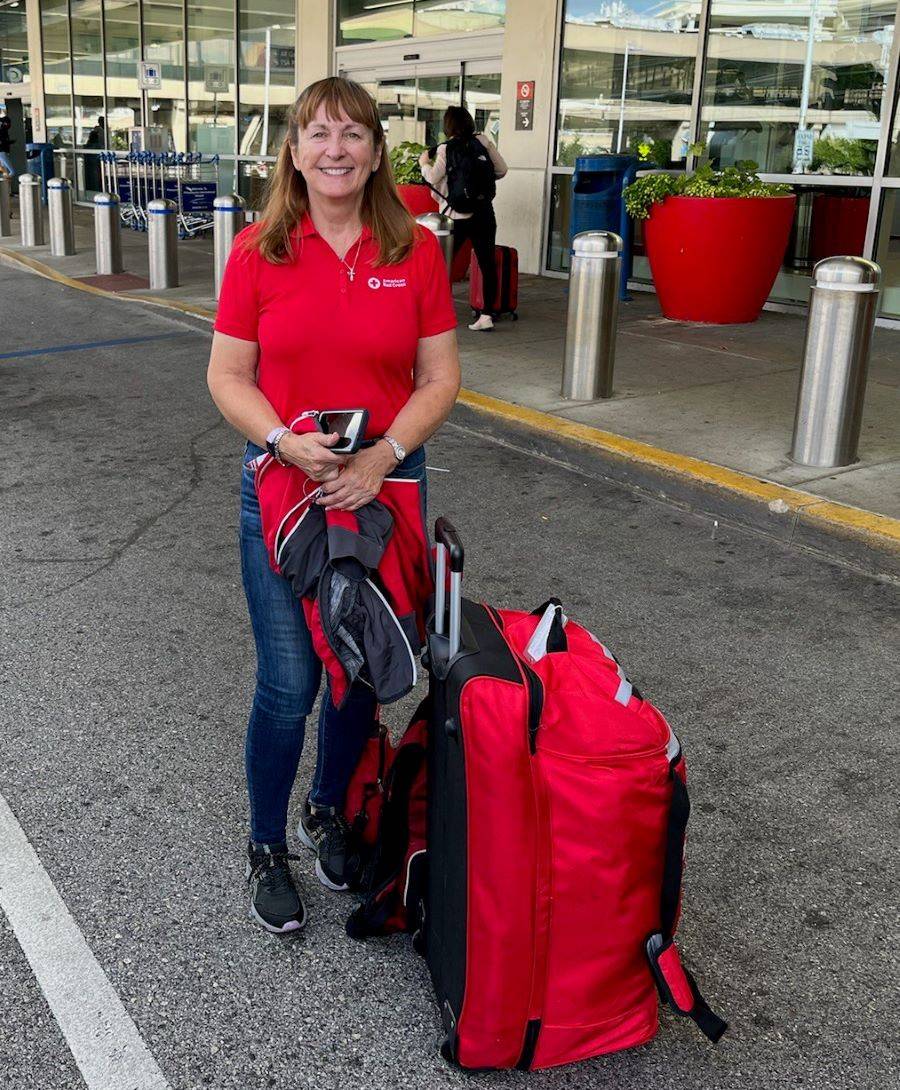 Mary Noll at the airport smiling