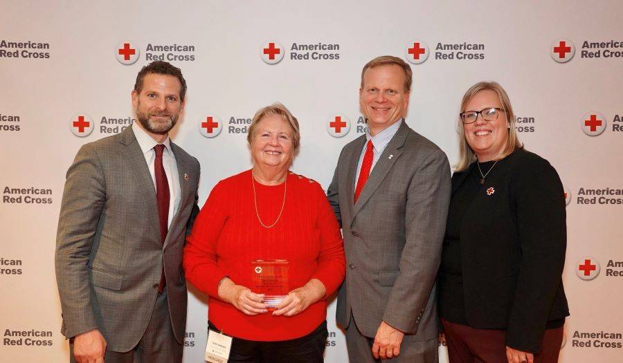 Terri Sirocka accepting red cross award