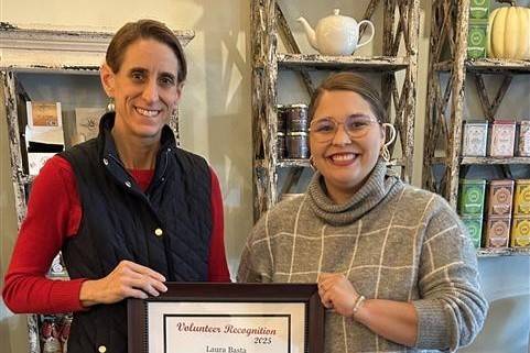 Two women stand side by side