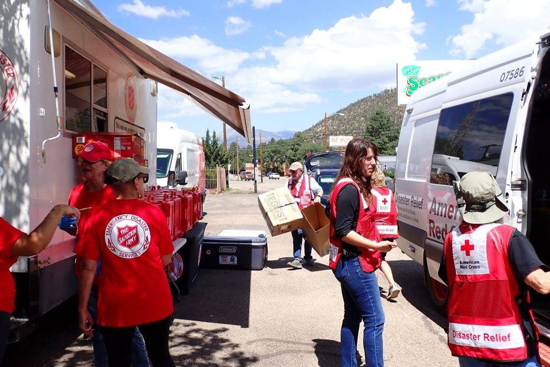 Red Cross and Salvation Army volunteers work side by side