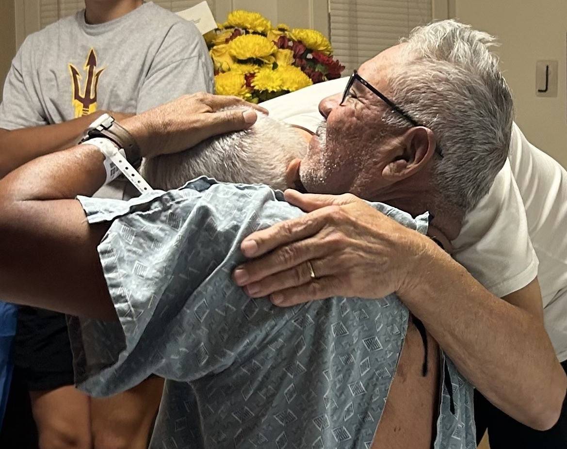 Tina hugs her father