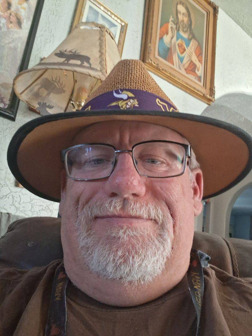 Leonard takes selfie while sitting inside a home