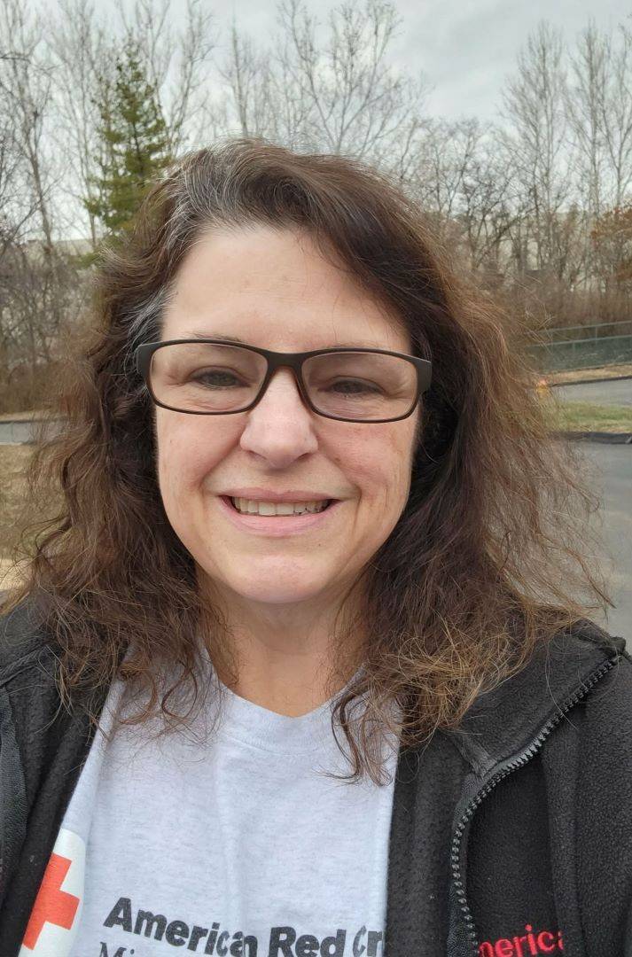 Selfie of woman in Red Cross shirt