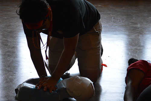 ldc staff training cpr on a manikin.