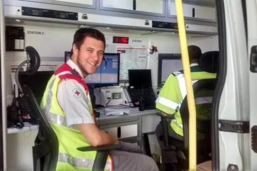Man at work station with mobile communications equipment
