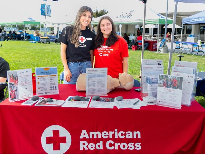 volunteers at red cross pop-up table