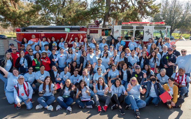 large group of central california red cross volunteers in front of firetruck