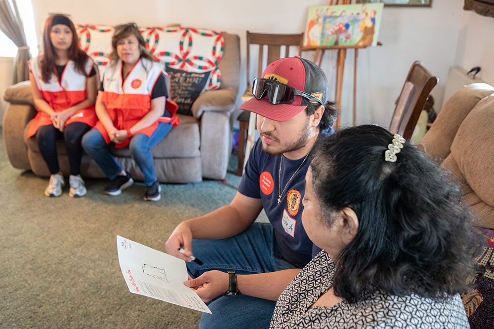 Red Cross volunteers helping residents with emergency escape route.