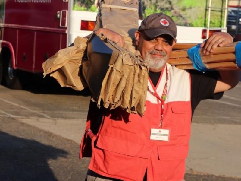jerry chavez carrying wood plates.