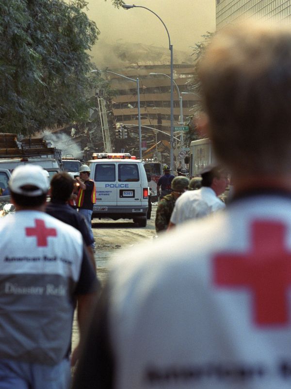 disaster volunteers viewing collapsing building