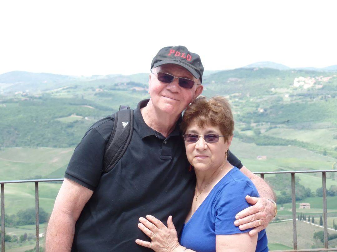 Man and women pose in front of overlook