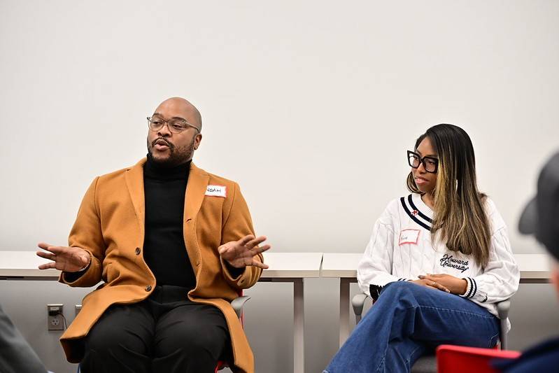 Man and woman sit next to each other while having discussion