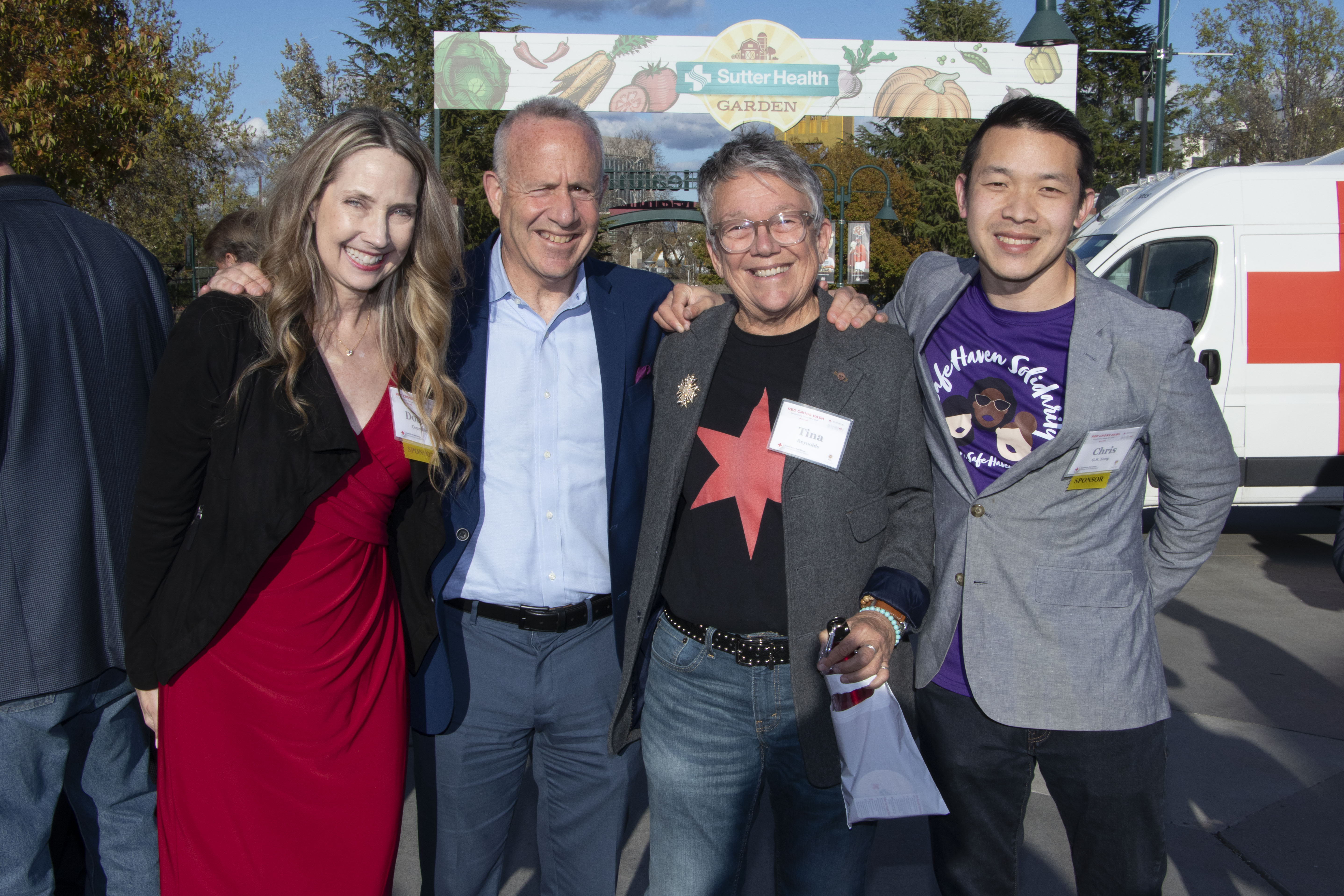 group of people at bash event in front of sutter health garden