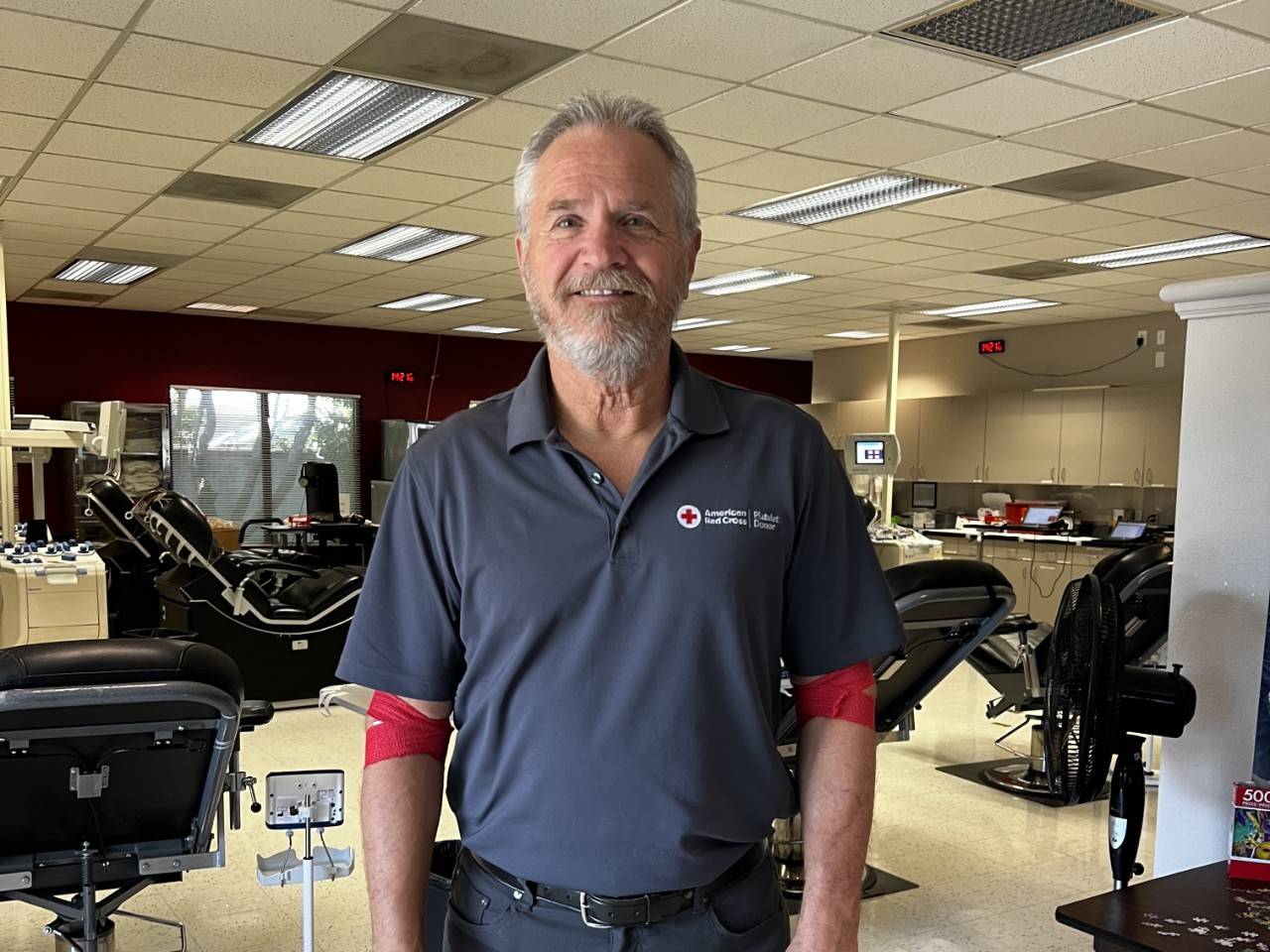 Steve Rogers stands in blood donation center after donating blood