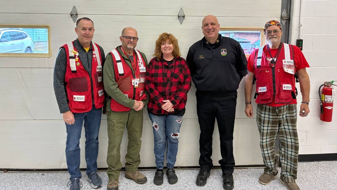 group of red crossers and fire department
