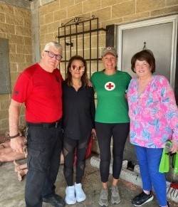 Group photo of Red Cross volunteers on front porch