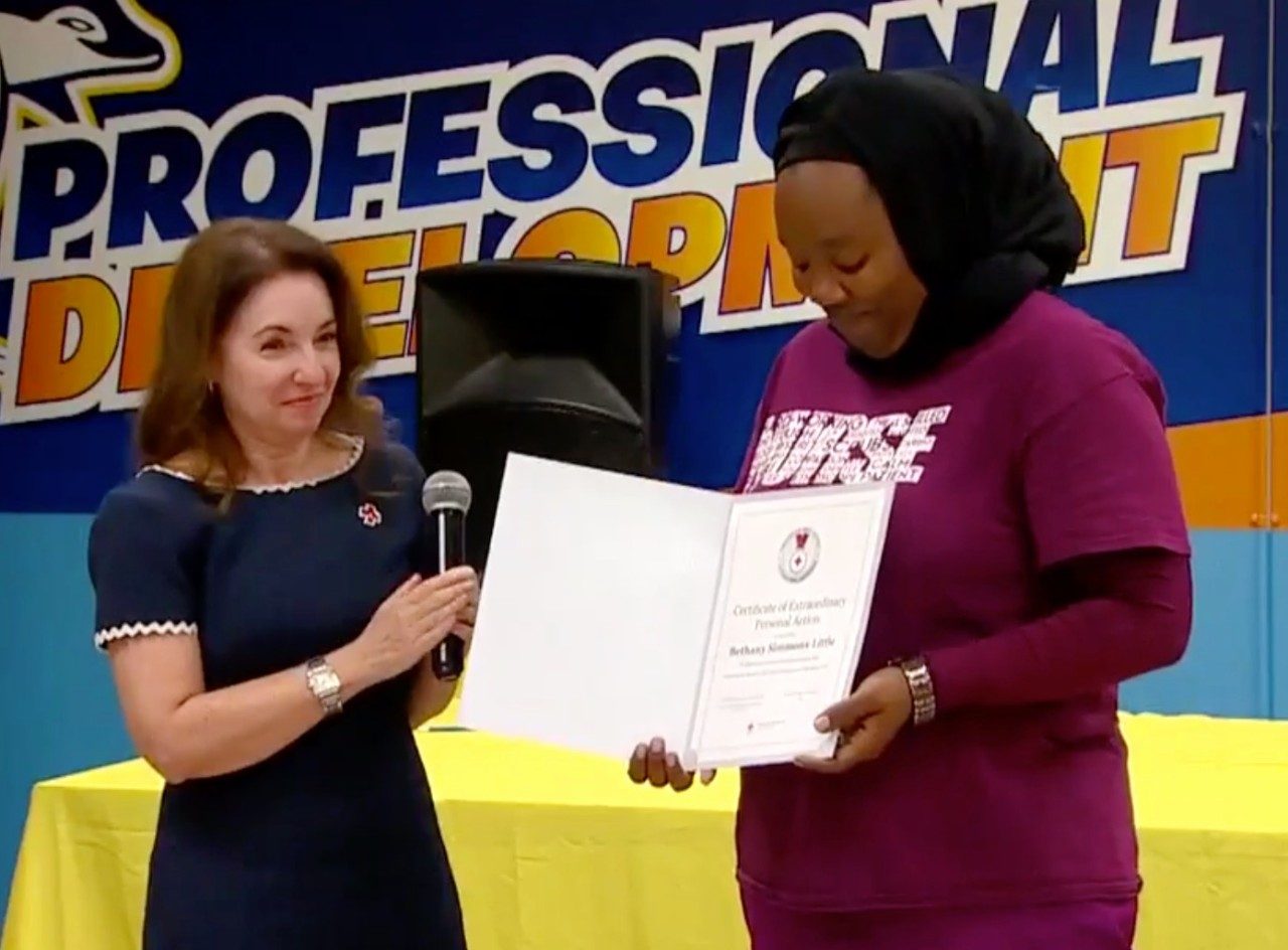 Photo of Nurse Little receiving national Life Saving Award