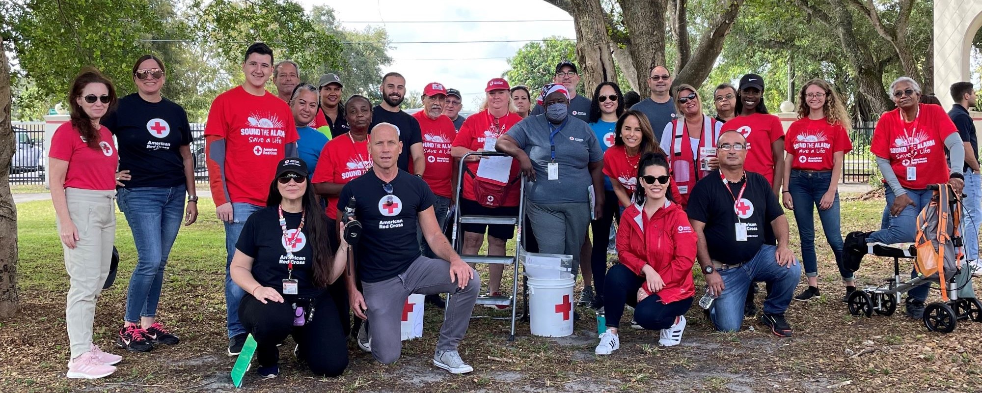 image of South Florida Red Cross volunteers and corporate partners preparing to install smoke alarms at a Sound the Alarm event in Opa-Locka, FL..