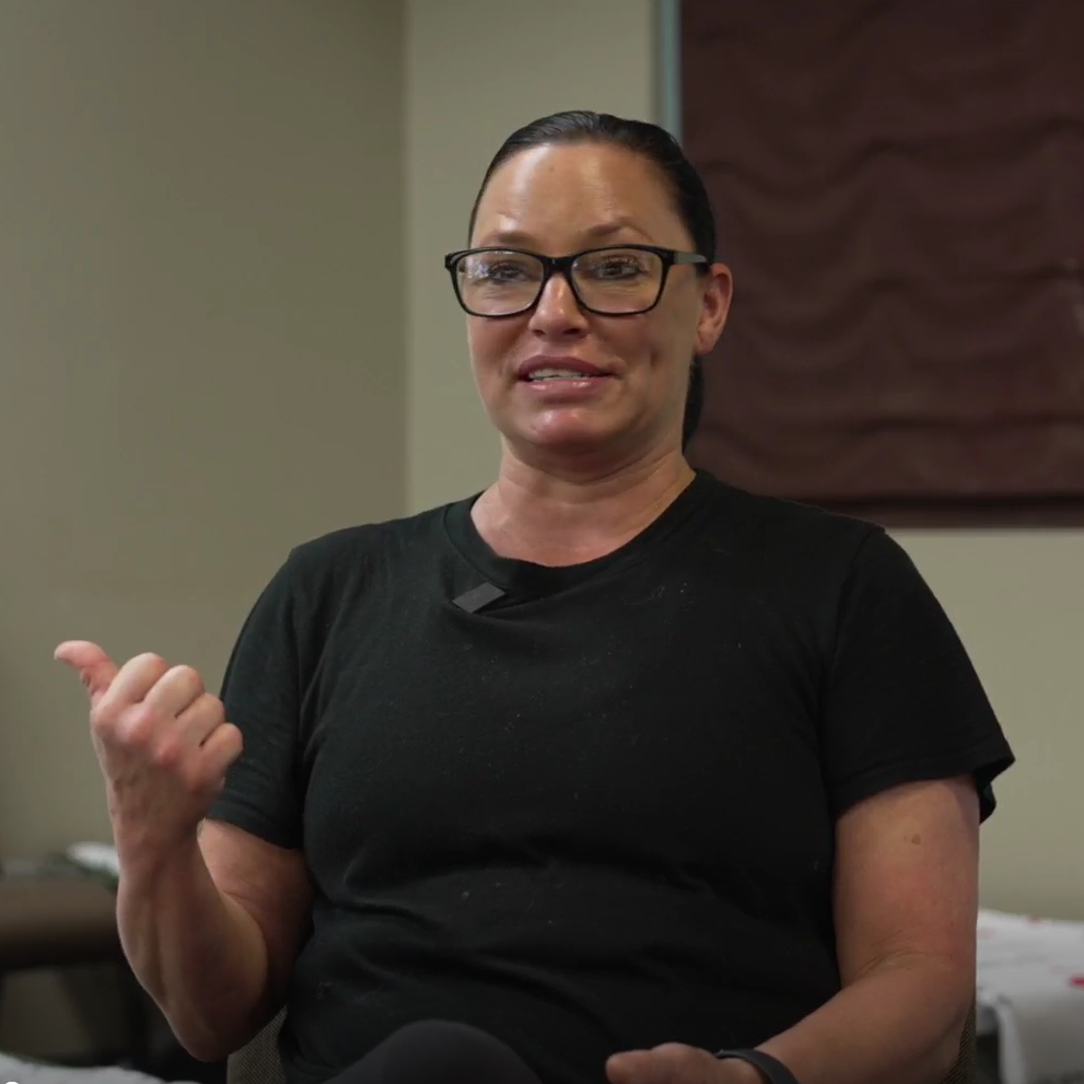 woman gestures hand while talking