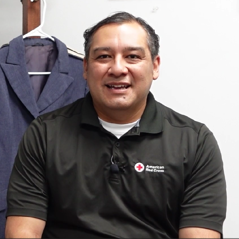Man in Red Cross shirt