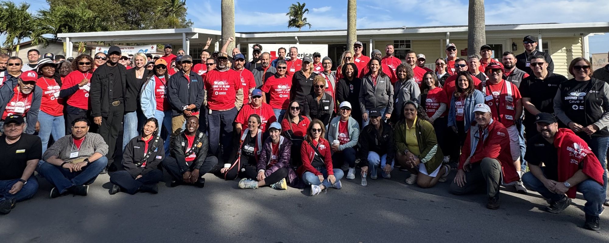 image of South Florida Red Cross volunteers and corporate partners preparing to install smoke alarms at a Sound the Alarm event in miami gardens.