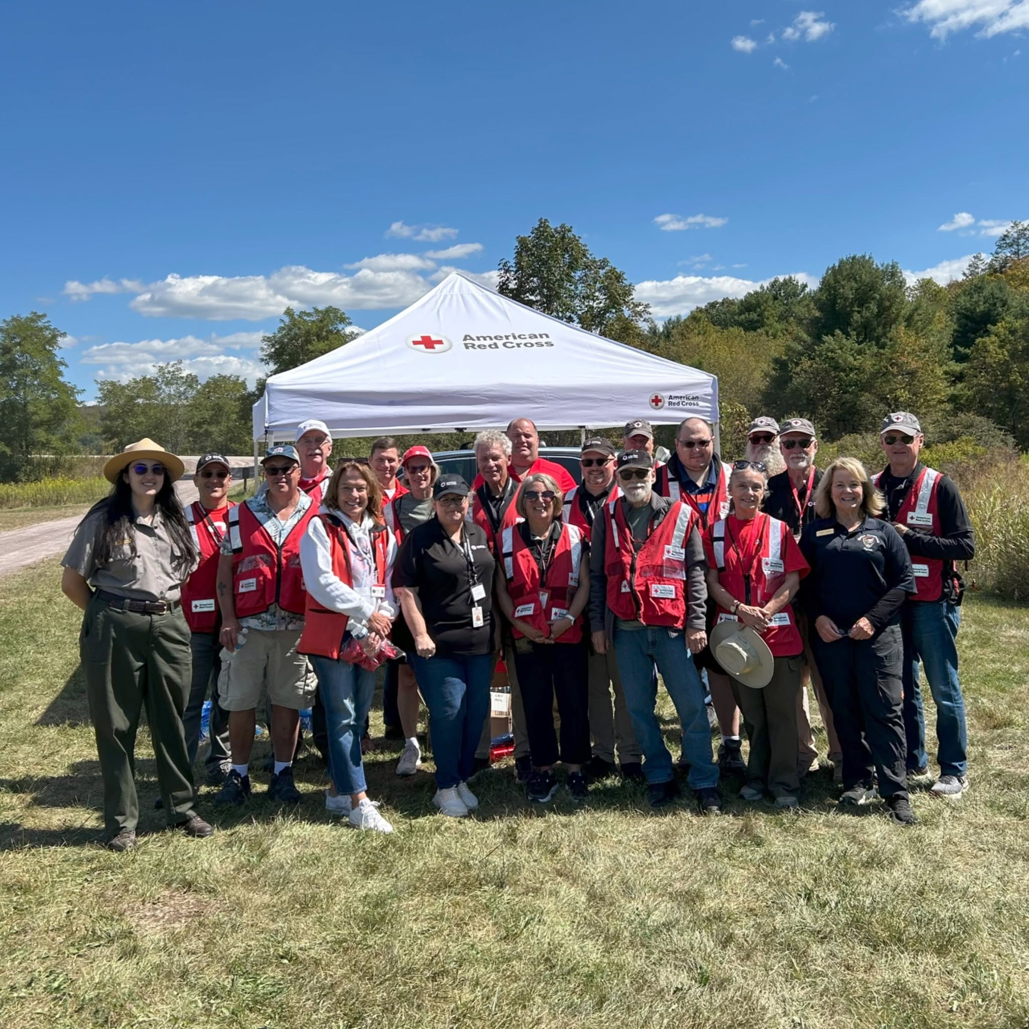 A group of Red Cross volunteers posing for a picture.