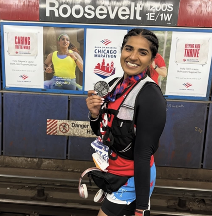 peter caputo holding award from marathon