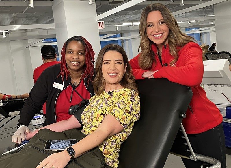 red crossers at news station donating blood