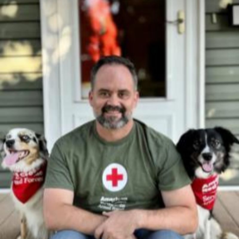 logan hamilton with two dogs