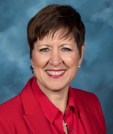 image of a woman in red blazer