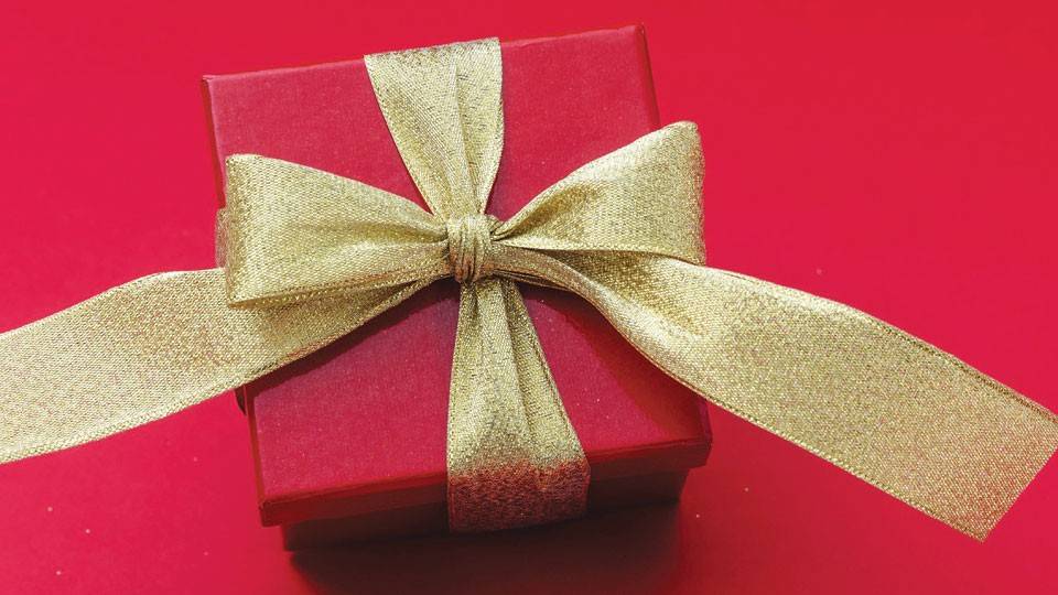 a small square red present with a golden ribbon. 
