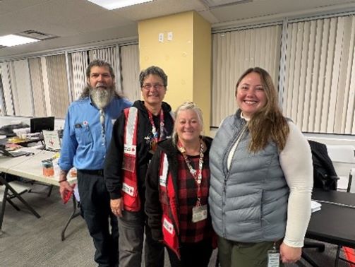 group of red cross staff and volunteers smiling