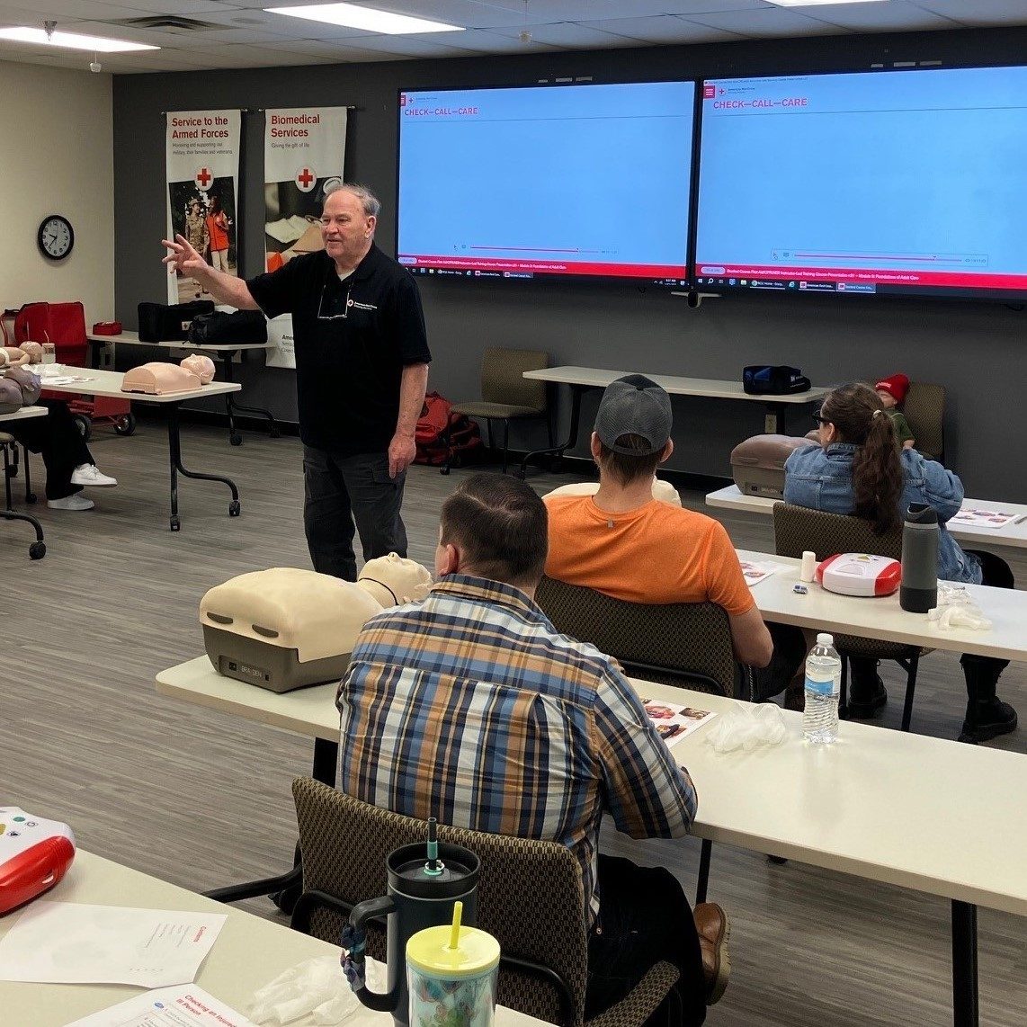 CPR instructor talks to students