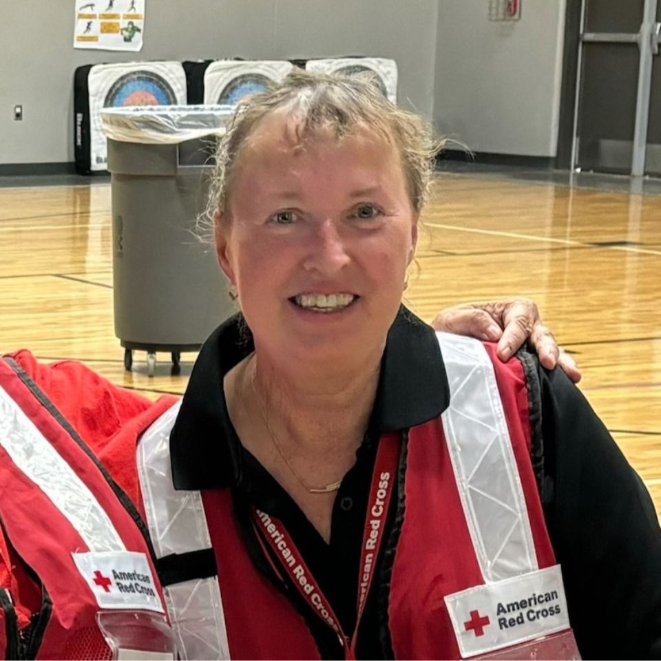 kris lange in red cross volunteer uniform