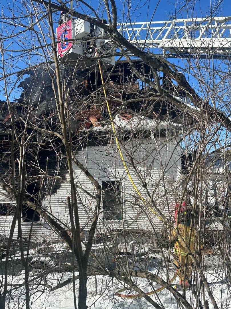 Image of home after home fire with fire department 