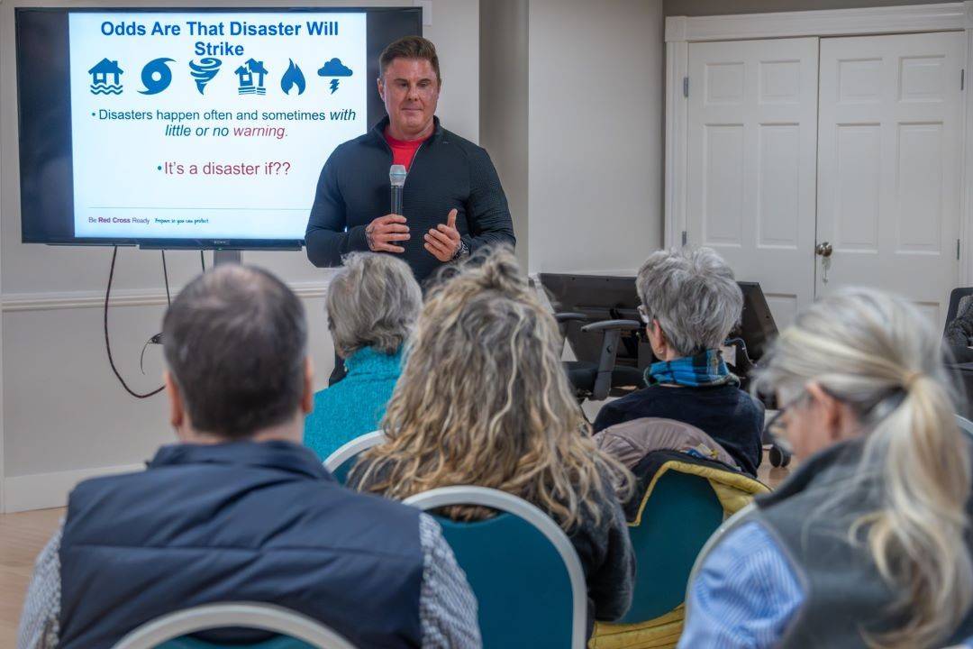 Man speaks to room of people