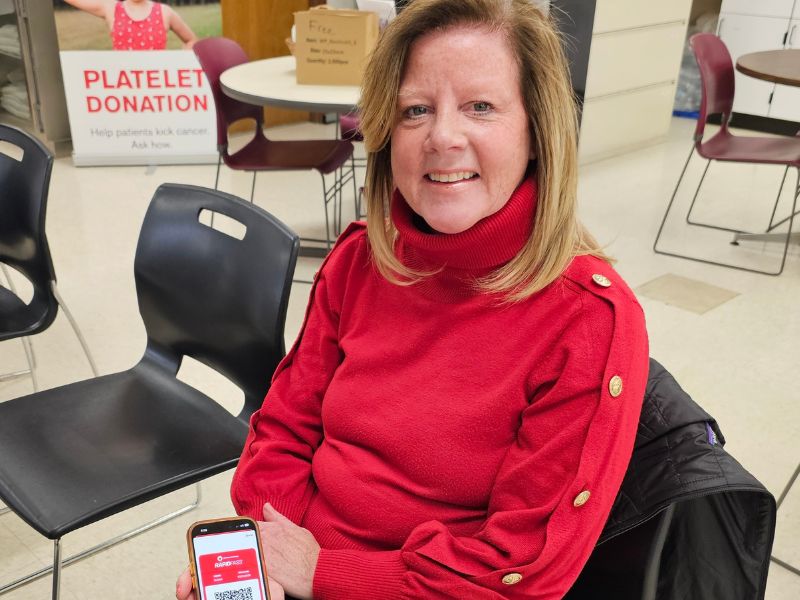 blood donor showing qr code on app