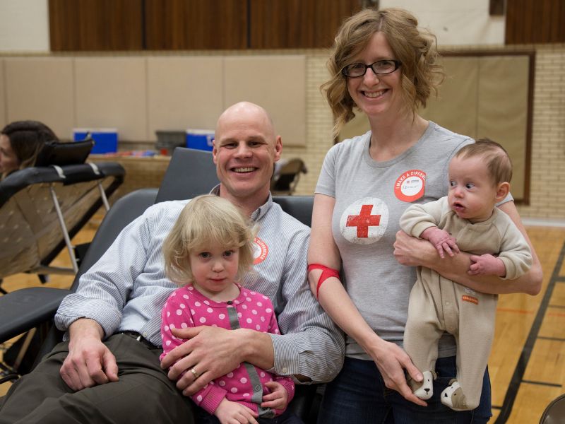 blood donor posing with family