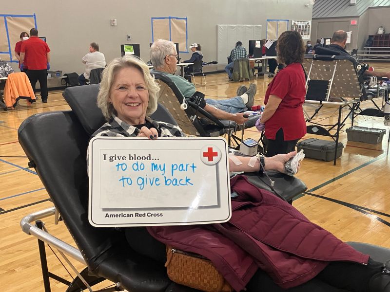 blood donor holding signage