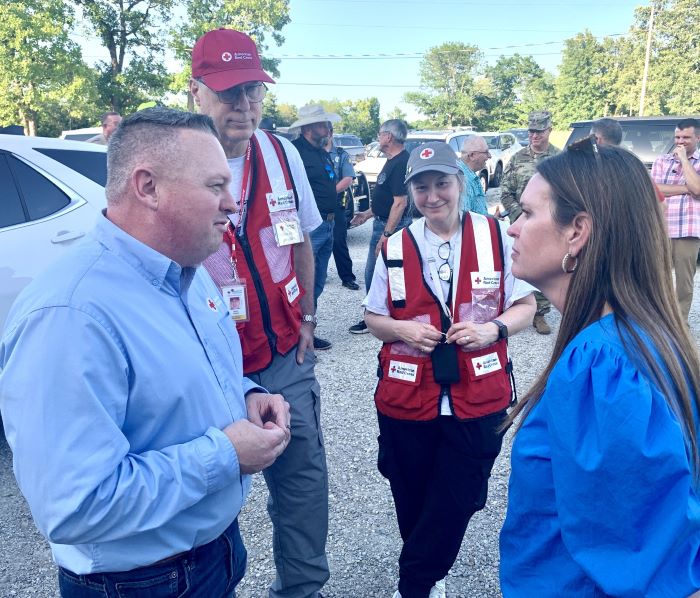 group of red cross volunteers gathered in a circle