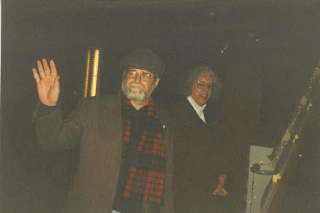 David Williams in 2002 wearing a hat and coat and waving.