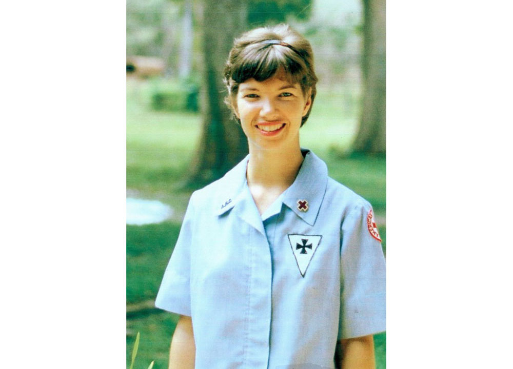 American Red Cross Donut Dolly volunteer, Margaret “Maggie" Goodrich Hodge in uniform and smiling for camera.