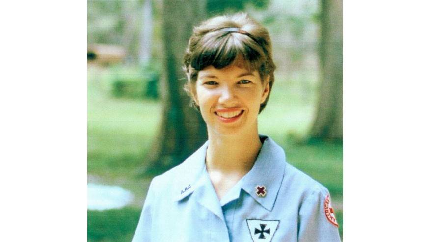 American Red Cross Donut Dolly volunteer, Margaret “Maggie" Goodrich Hodge in uniform and smiling for camera.